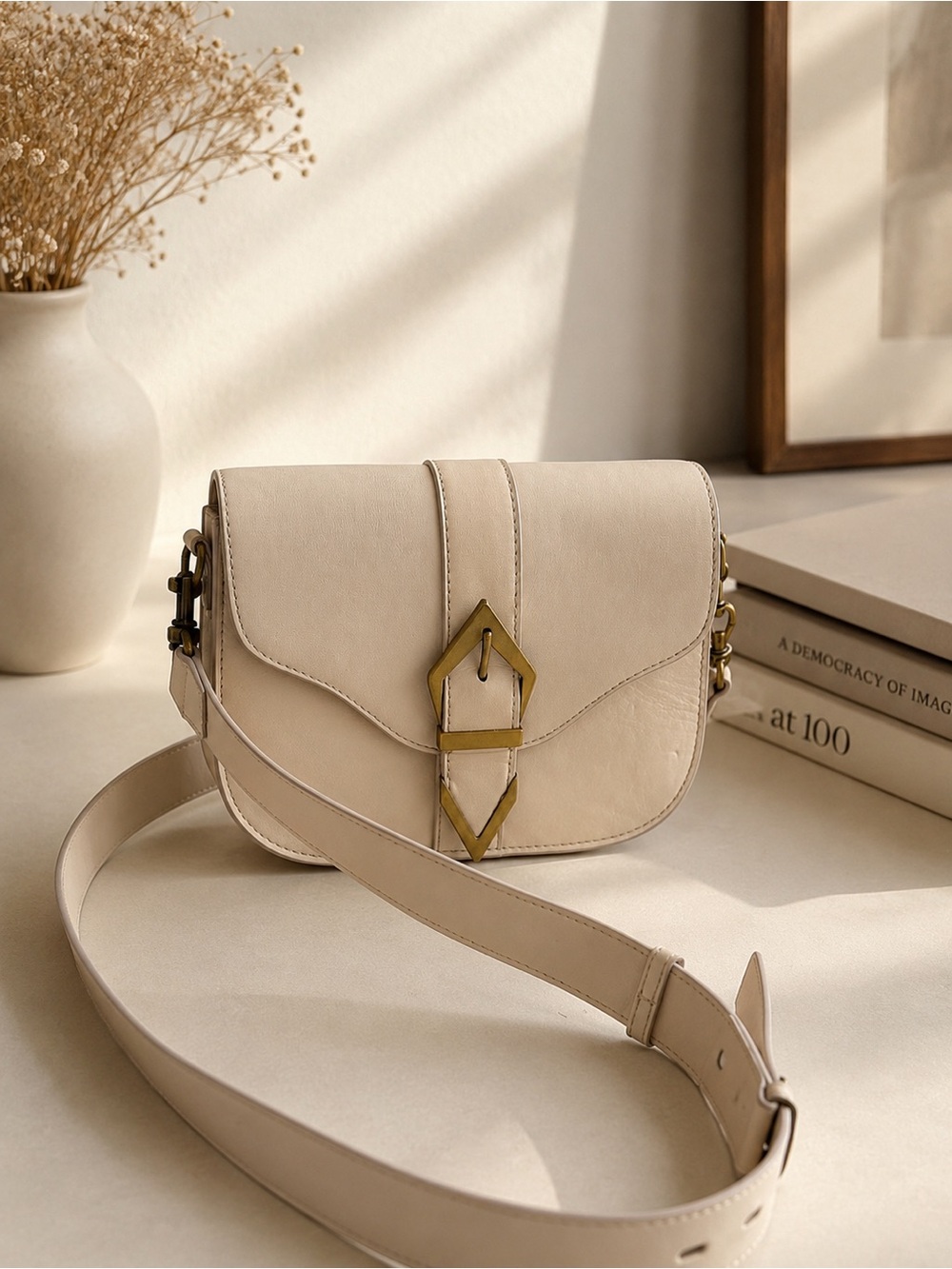 Elegant Vince Camuto crossbody bag in a soft cream/ivory shade